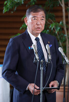 Japanese Prime Minister Shigeru Ishiba responds to questions from reporters at the prime minister's office in Tokyo after U.S. President Donald Trump announced a 25 pct tariff on Japanese imports.