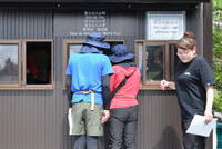 Climbers go through entry procedures at the fifth station of the Fujinomiya trail on Mount Fuji in the city of Fujinomiya, Shizuoka Prefecture, on Thursday morning.