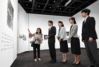 Japan's Crown Prince Akishino, Crown Princess Kiko, their second daughter, Princess Kako, and their son, Prince Hisahito, on Friday visit a photo exhibition on the Aug. 6, 1945, U.S. atomic bombing of the western Japan city of Hiroshima, being held at the Tokyo Photographic Art Museum. (Pool photo)