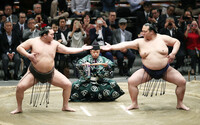 Then yokozuna grand champions Hakuho (left) and Kisenosato (right) demonstrate the