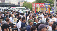 People listen to a stump speech ahead of Sunday's House of Councillors election in Hirosaki, Aomori Prefecture, on Monday.