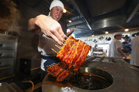 A staff member grills eels on Saturday, this year's Day of Ox, at Yatsumeya Nishimura, an eel restaurant in Tokyo's Meguro Ward.
