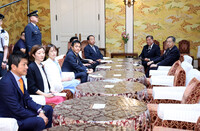Prime Minister and LDP chief Shigeru Ishiba (second right) meets with other political party leaders in Tokyo on Friday.