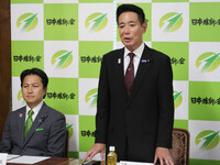 Seiji Maehara (right), co-leader of Nippon Ishin no Kai (Japan Innovation Party), and Ryohei Iwatani, secretary-general of the opposition party, announce their plans to resign, at an emergency meeting of party executives held in Tokyo on Tuesday.