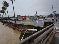 Heavy rain destroys an embankment for the Amikake River in the city of Aira, Kagoshima Prefecture, southwestern Japan. (Courtesy of the Kagoshima prefectural government)