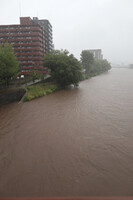 The Shirakawa River with rising water levels due to heavy rain in the city of Kumamoto on Monday