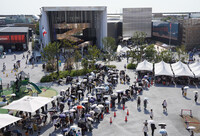 People line up to enter a pavilion at the Osaka Expo on Friday.