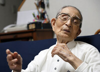 Satoshi Ito, 102, attends an interview in the city of Akashi, Hyogo Prefecture, on June 8, talking about the 