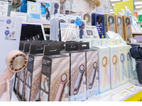 Handheld fans fill shelves at a summer cooling goods section at the Hands Shinjuku store in Tokyo.