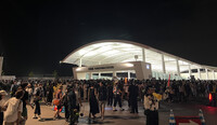 Crowds gather as entry restrictions are enforced in front of Osaka Metro's Yumeshima Station in Osaka's Konohana Ward on Wednesday.