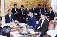 Economic revitalization minister Ryosei Akazawa (far right) attends a meeting of senior members of the House of Representatives' Budget Committee on Friday.