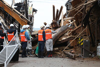 Employees of the city government of Wajima, Ishikawa Prefecture, central Japan, working to assess building damage from a powerful earthquake striking the region on Jan. 1, 2024, a step needed for issuing a damage certificate