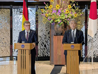 Japanese Foreign Minister Takeshi Iwaya (right) and his German counterpart, Johann Wadephul, hold a joint press conference in Tokyo on Monday.