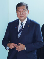 Prime Minister Shigeru Ishiba enters his office in Tokyo on Tuesday.
