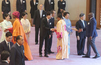 Japanese Emperor Naruhito, Empress Masako and other Imperial Family members greet African leaders for a tea ceremony at the Imperial Palace in Tokyo on Friday.