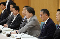 Japanese Chief Cabinet Secretary Yoshimasa Hayashi (third from right) speaks at a ministerial meeting in Tokyo on Tuesday on disposal of soil from decontamination in Fukushima.