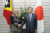 Japanese Prime Minister Shigeru Ishiba (right) shakes hands with East Timor President Jose Ramos-Horta at the prime minister's office in Tokyo on Tuesday.